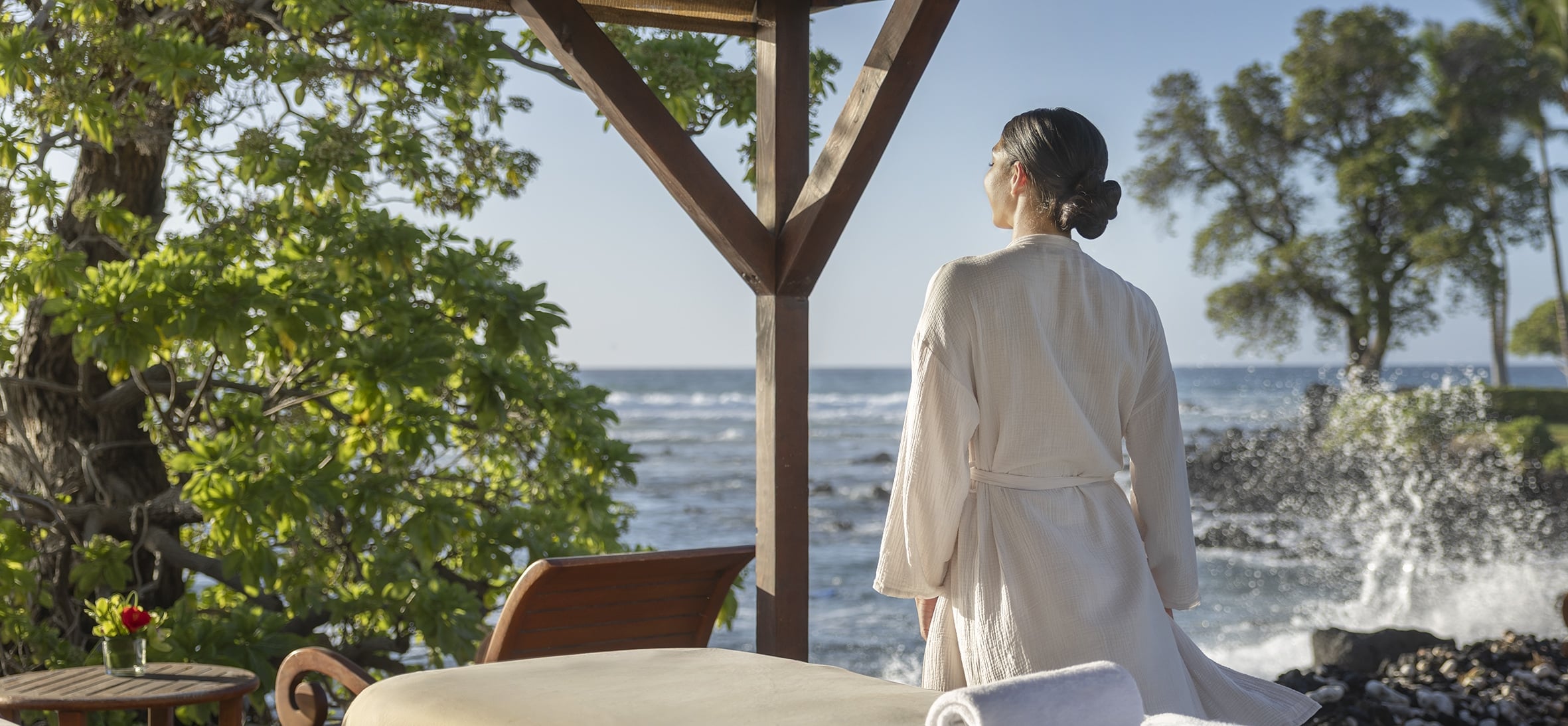Woman looking out at ocean in spa