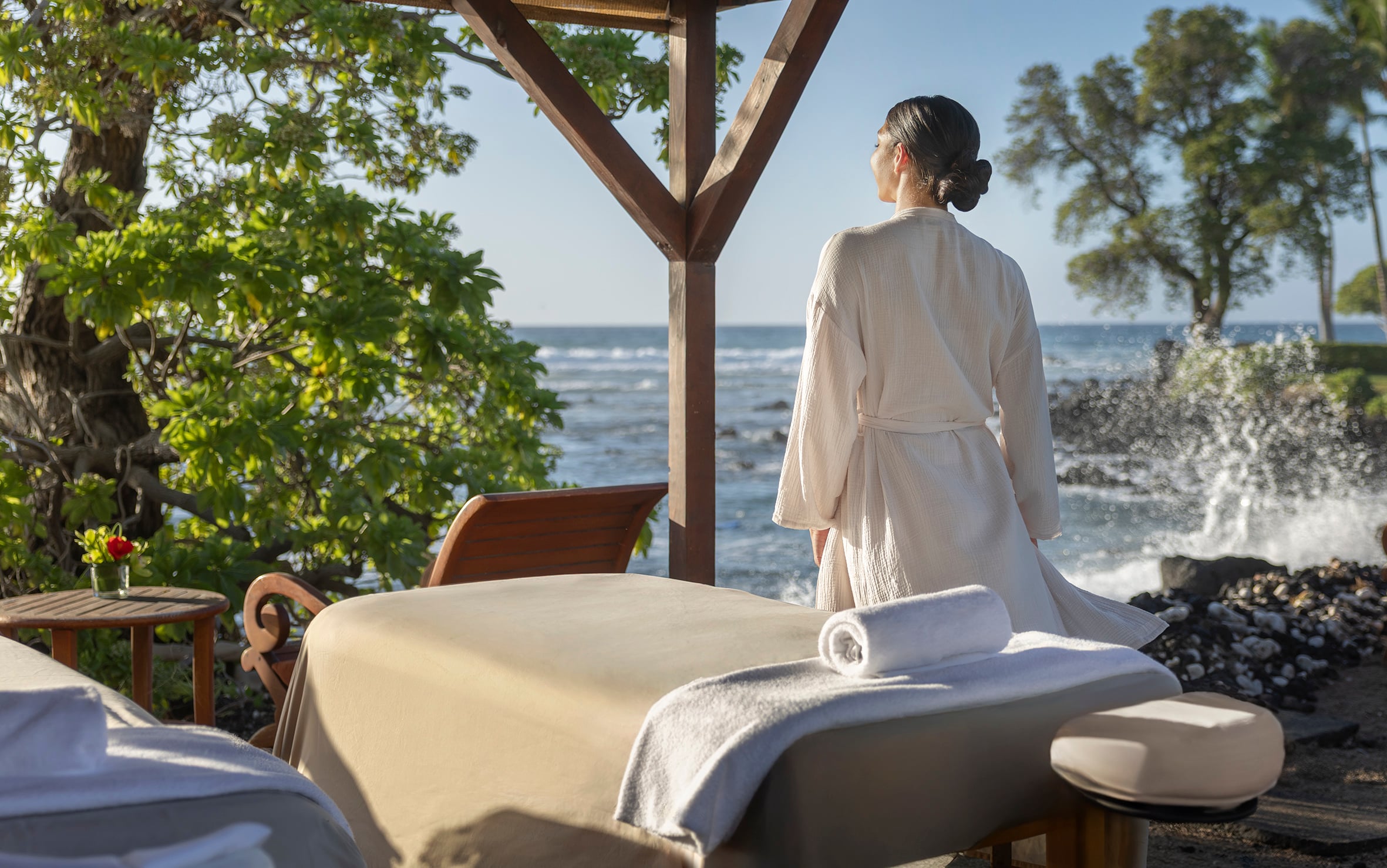Woman looking out at ocean in spa