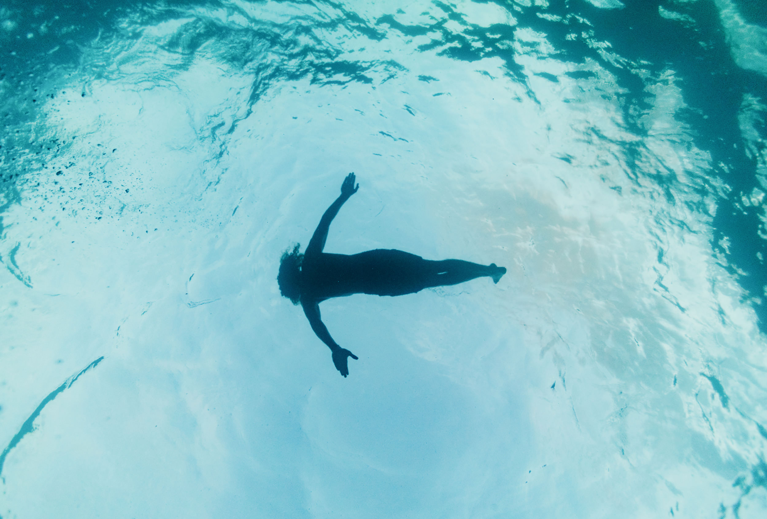 person floating in the ocean