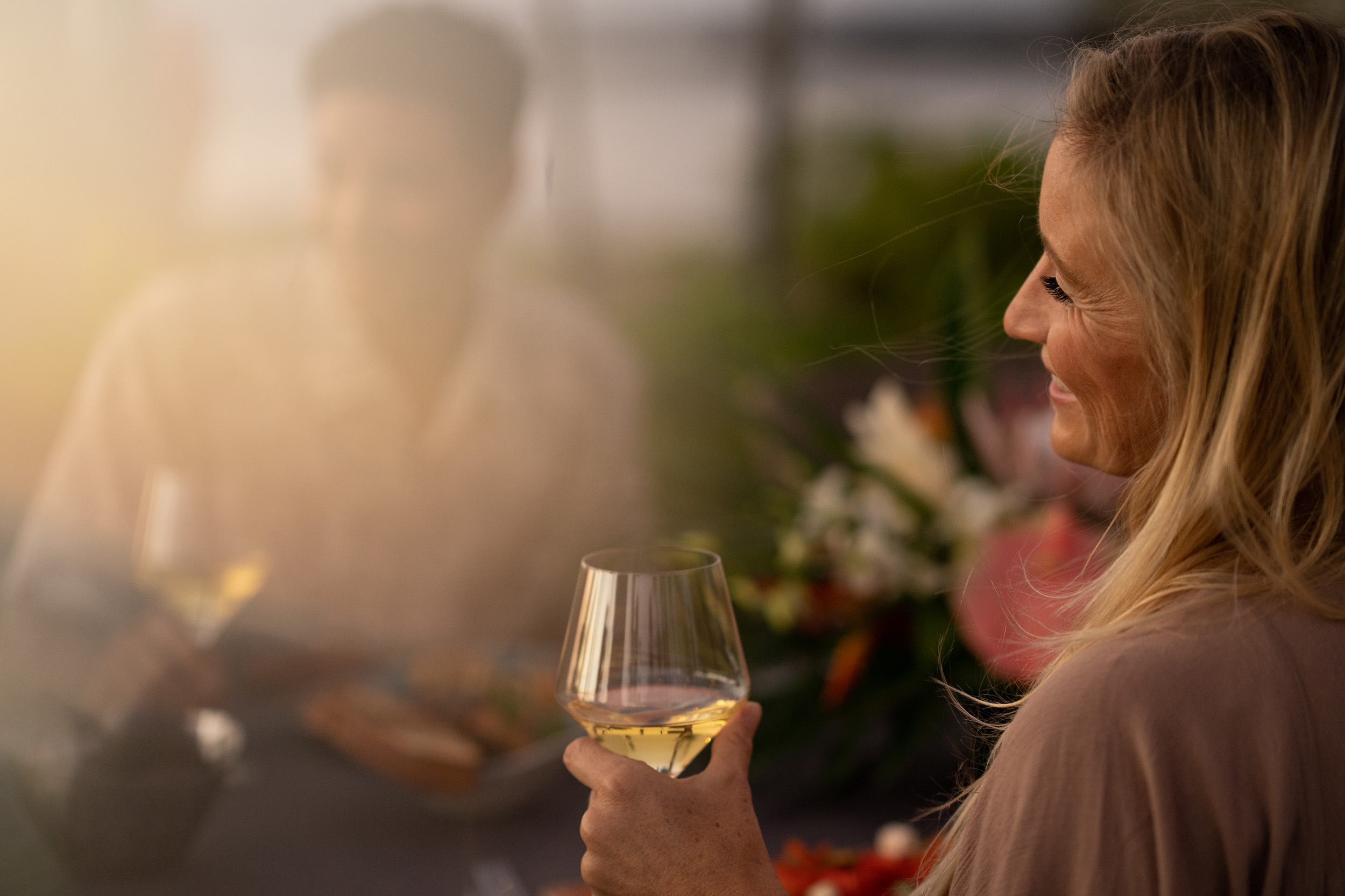 woman holding a glass of wine