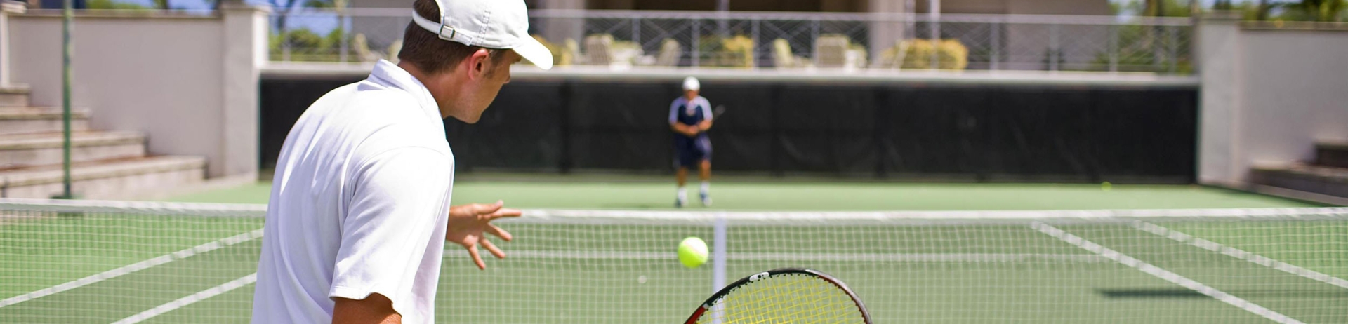 two men playing tennis