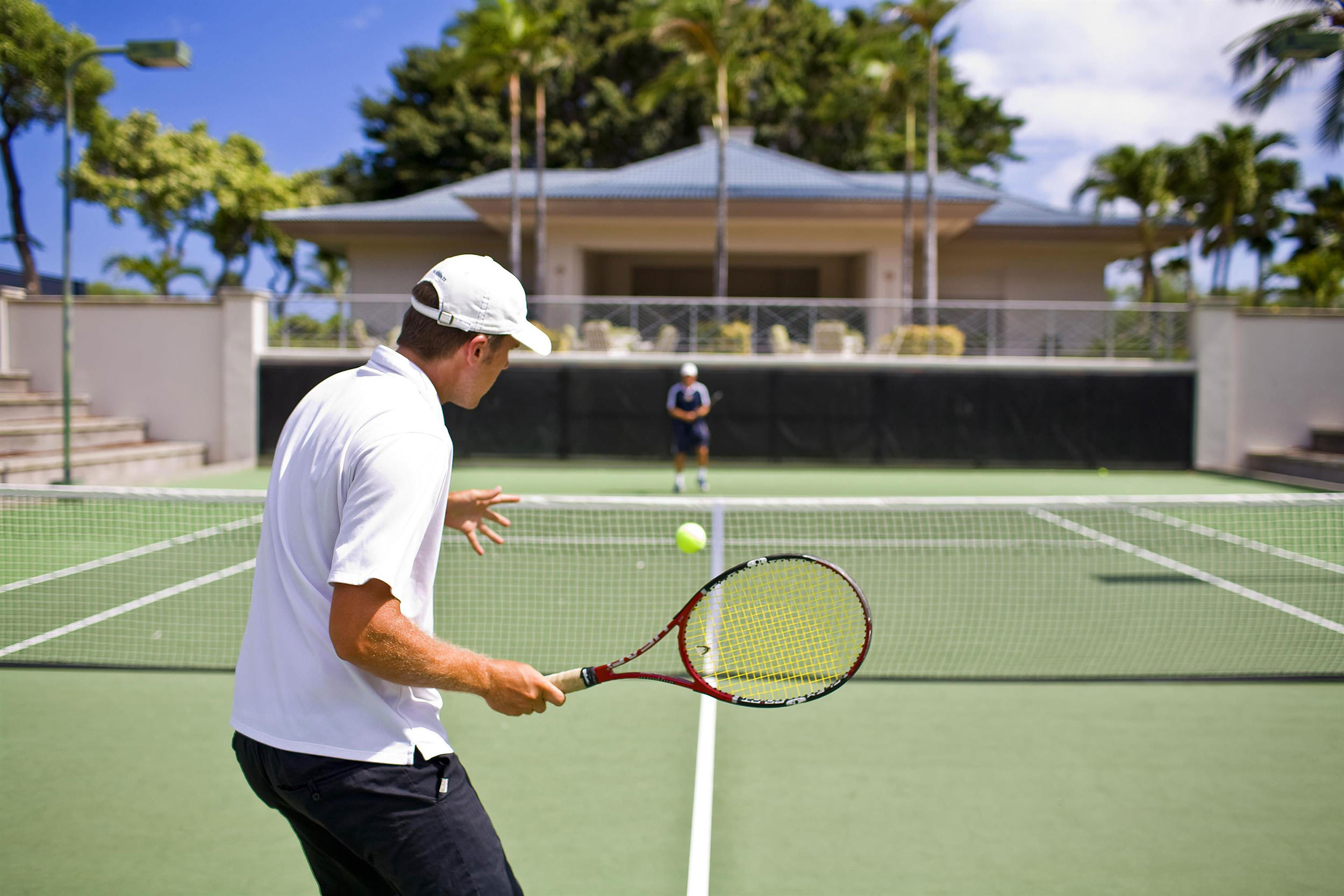 two men playing tennis
