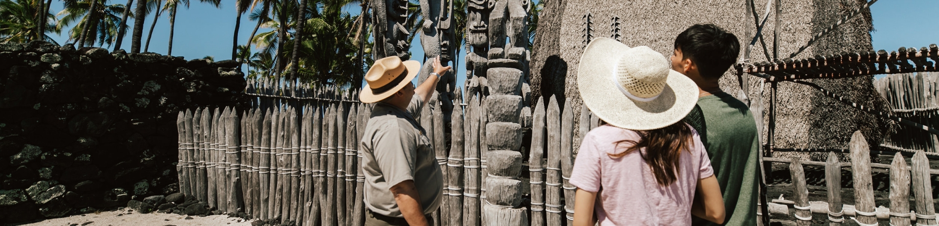 a couple learning about sculptures