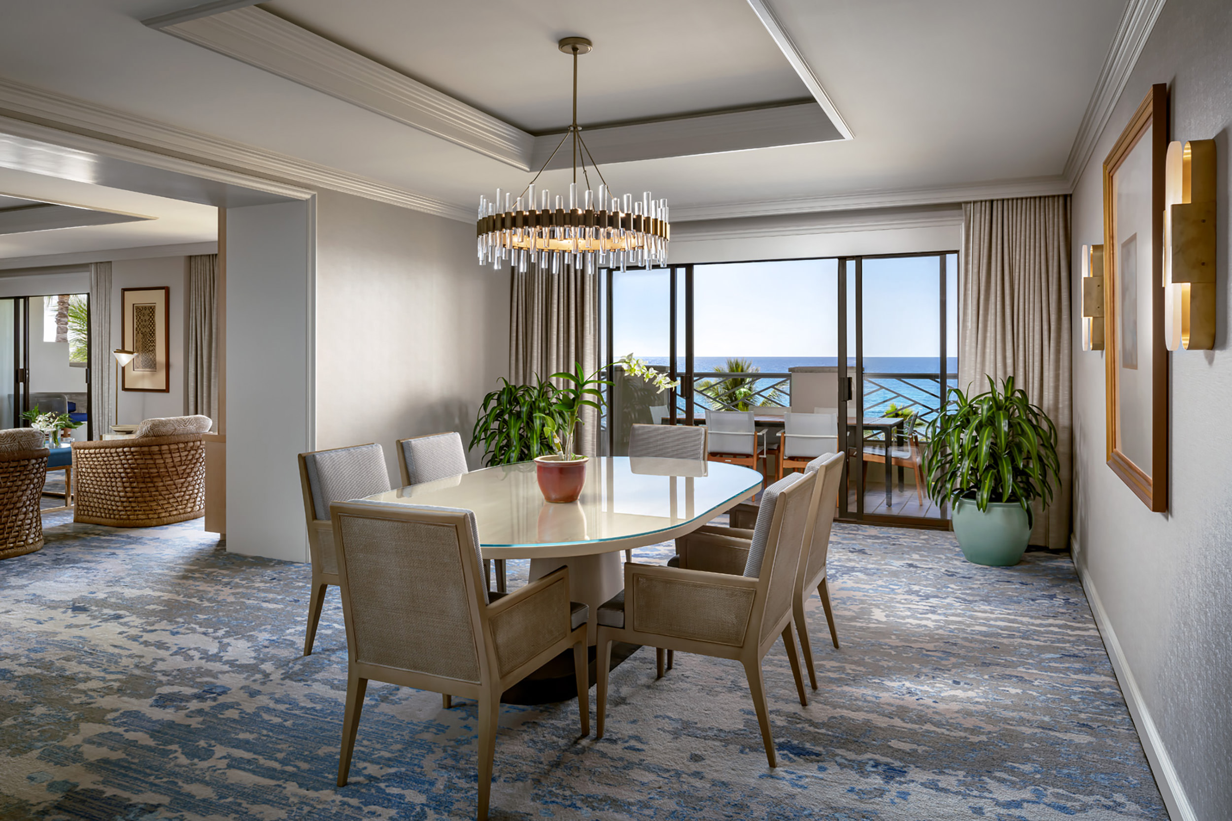 dining room table with balcony in the background