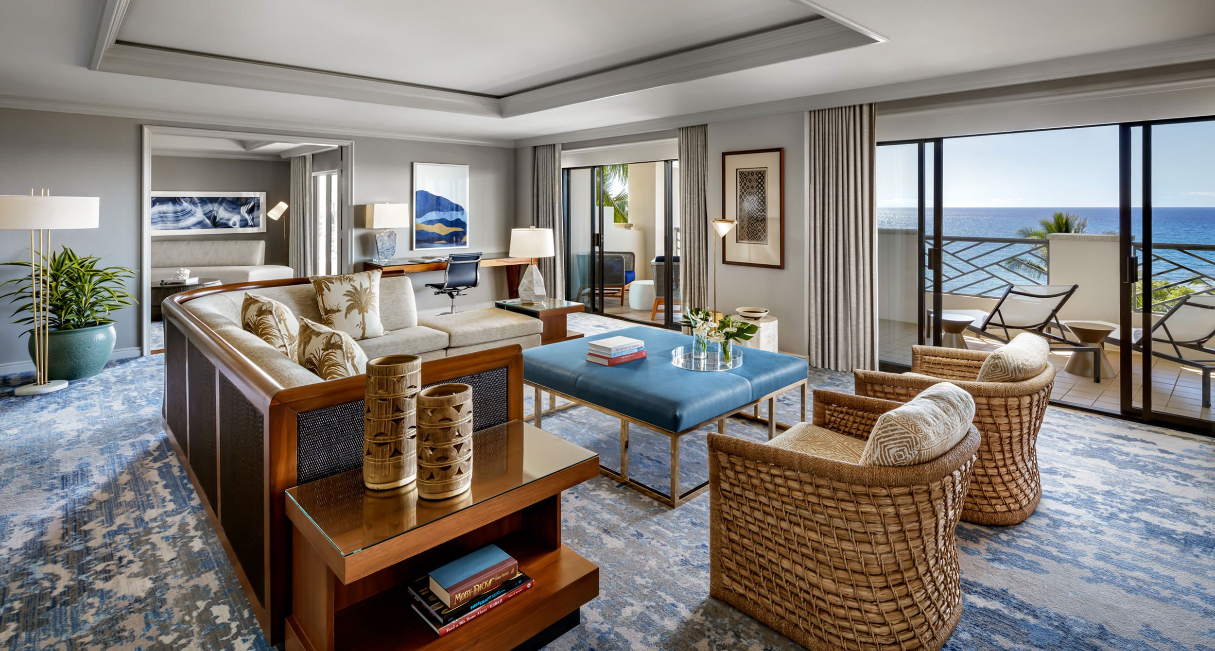 living room area with hints of blue and wicker