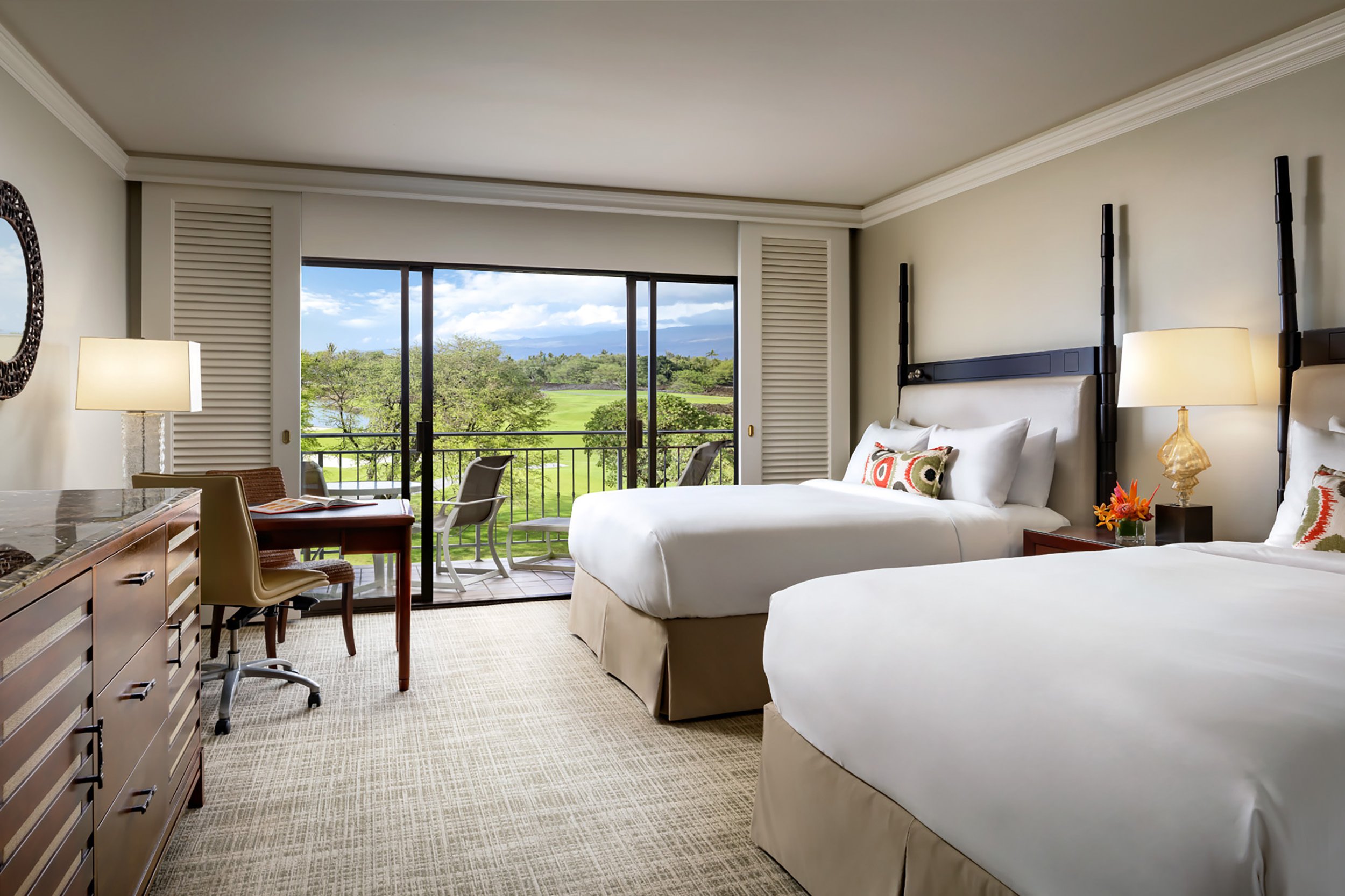 bedroom with two beds and balcony