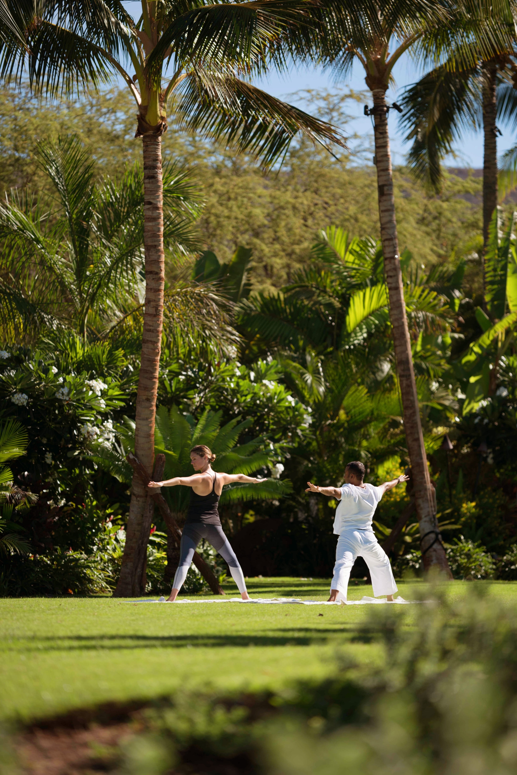 two people doing yoga