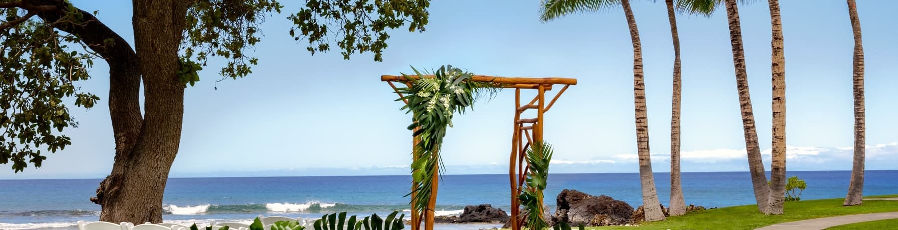 outdoor ceremony set up with beach in the background