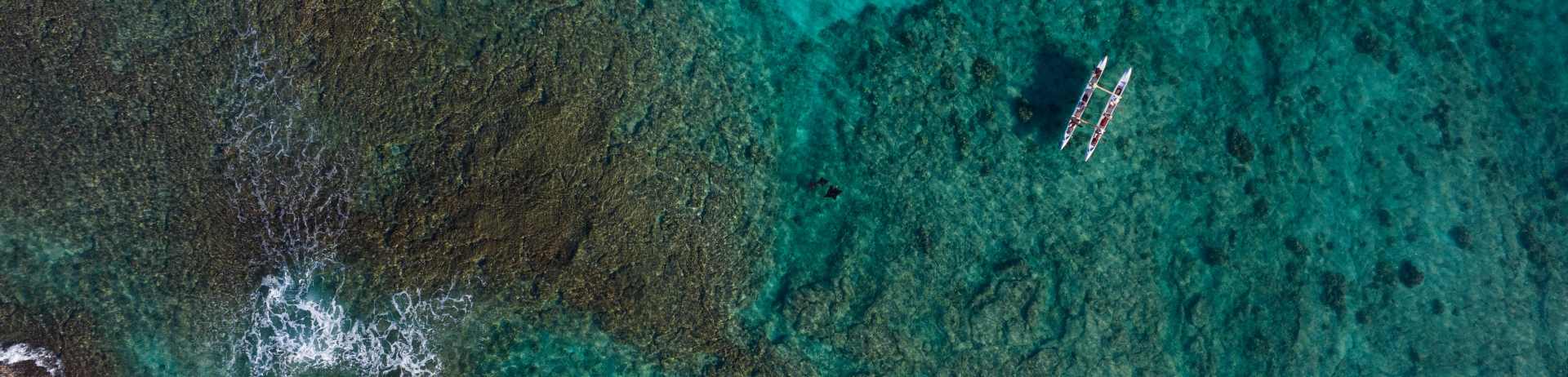 aerial view of canoe in ocean