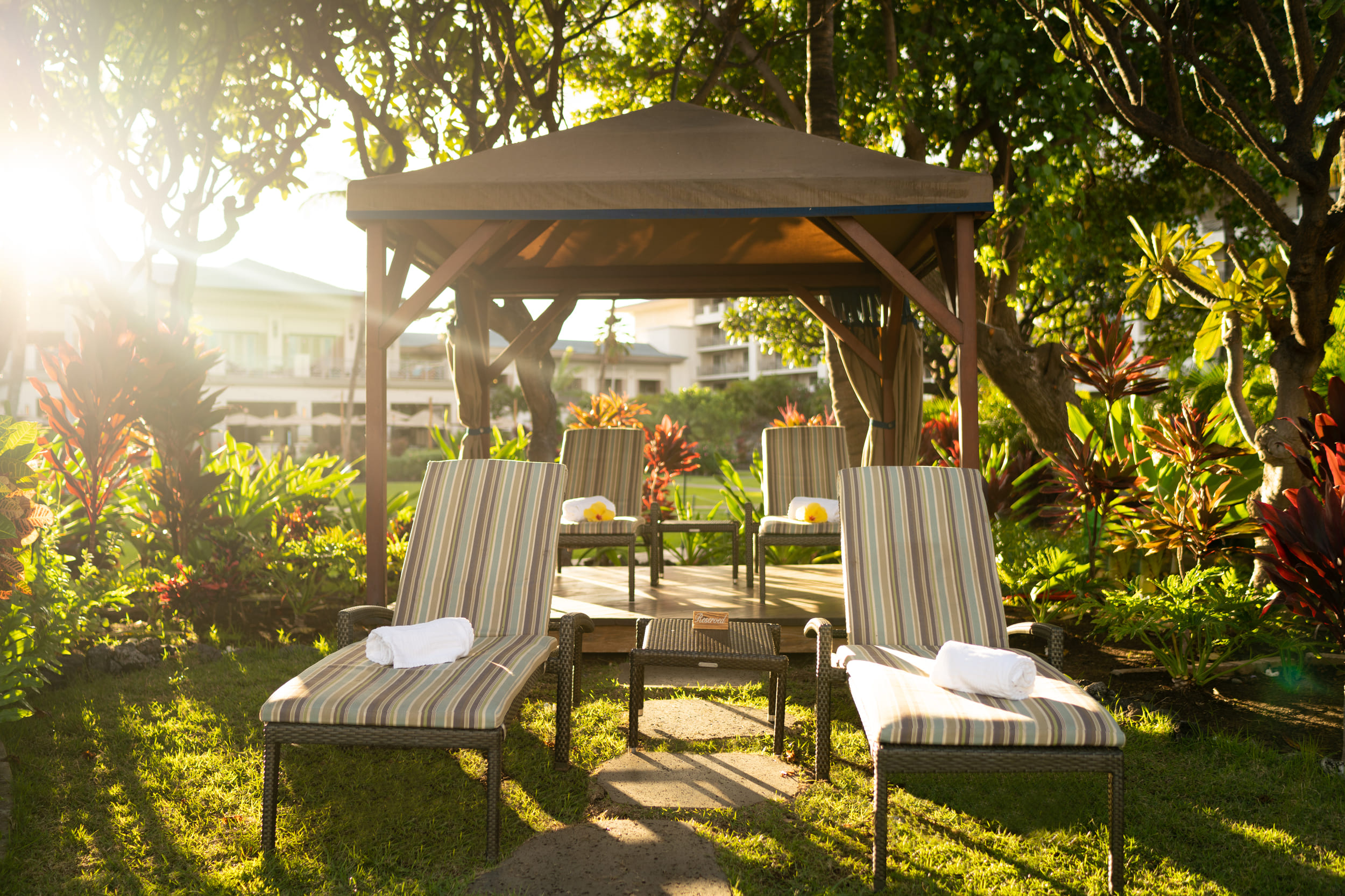 lounge chairs under an open cabana