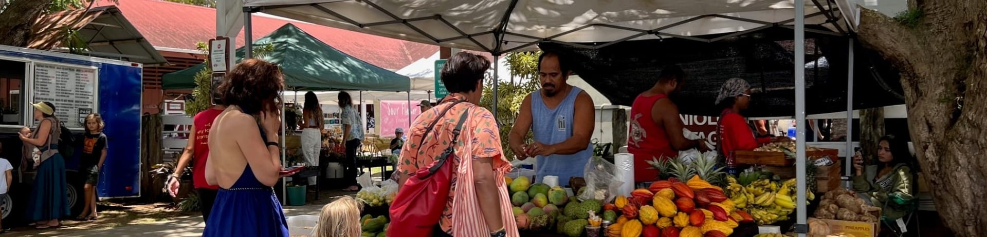 Family at fruit and vegetable stand