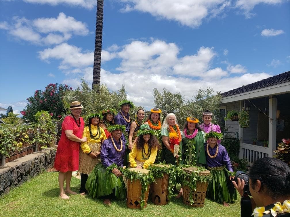 group of people in front of their drums