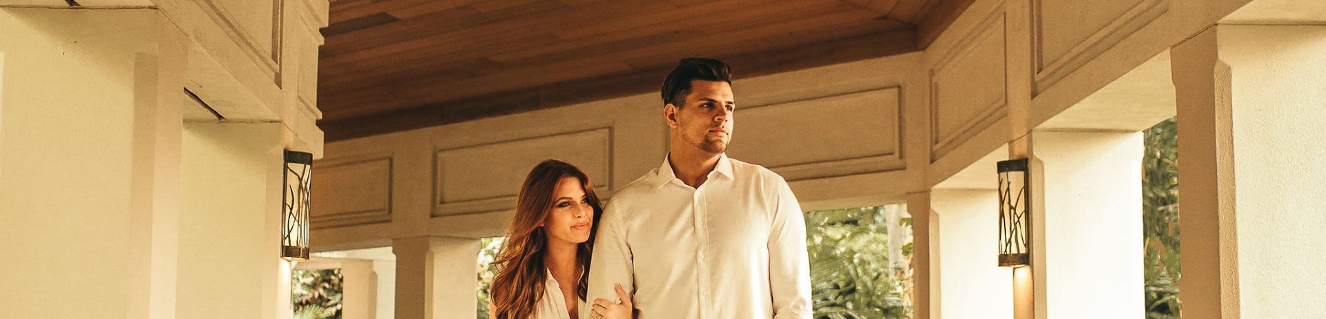 Woman and man walking down hallway