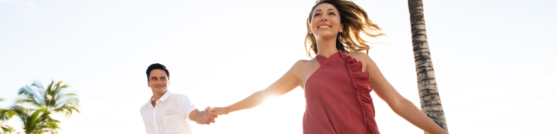 couple holding hands on the beach