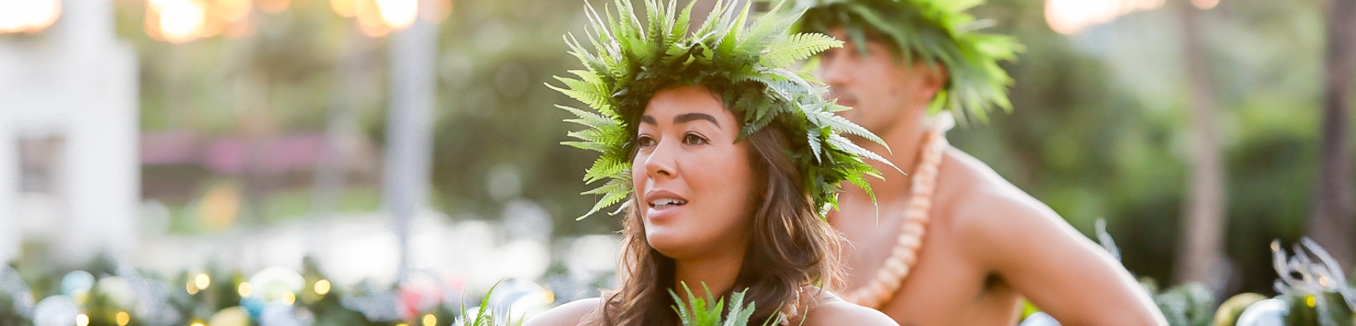 Woman and man dancing hula