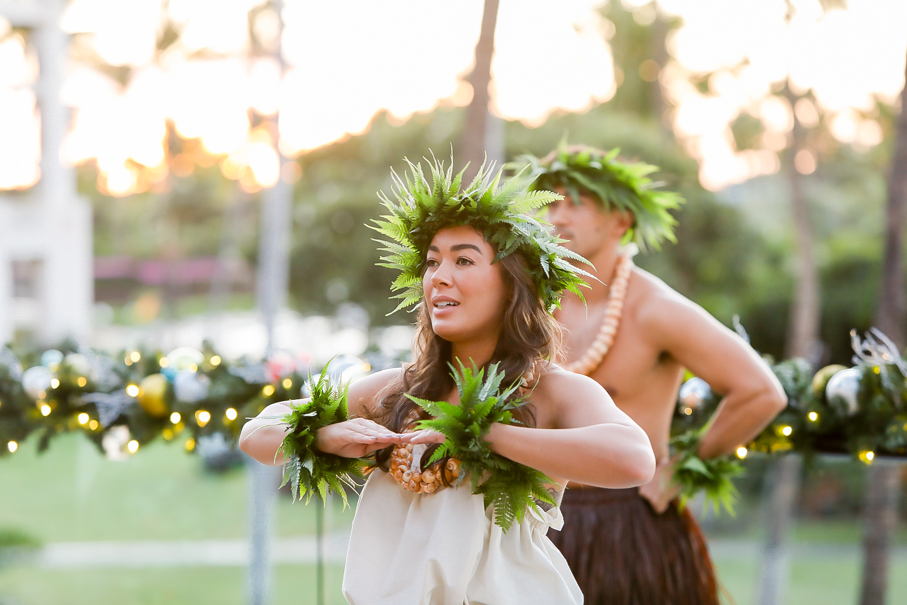 Woman and man dancing hula