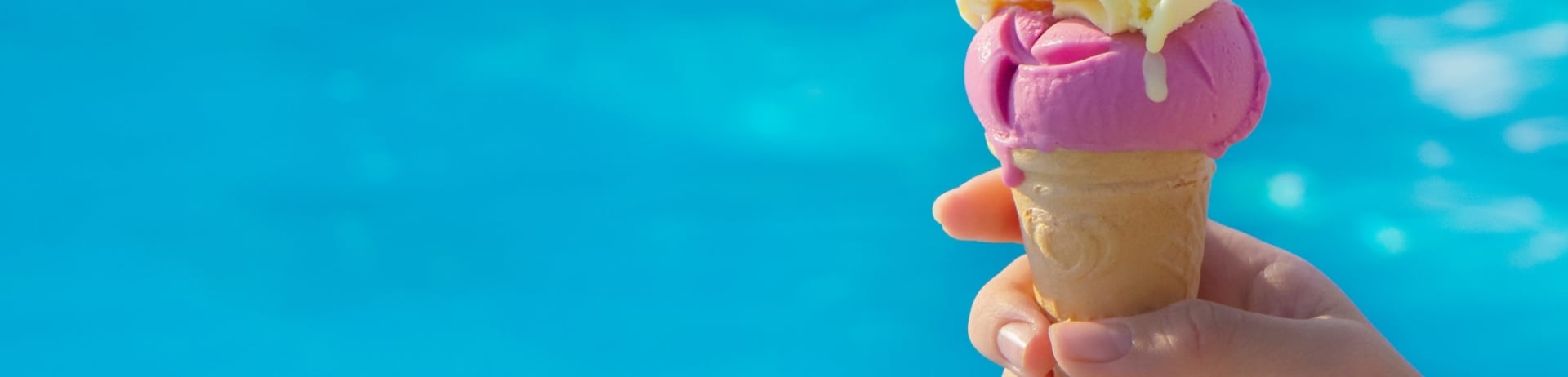 Ice cream on swimming pool background