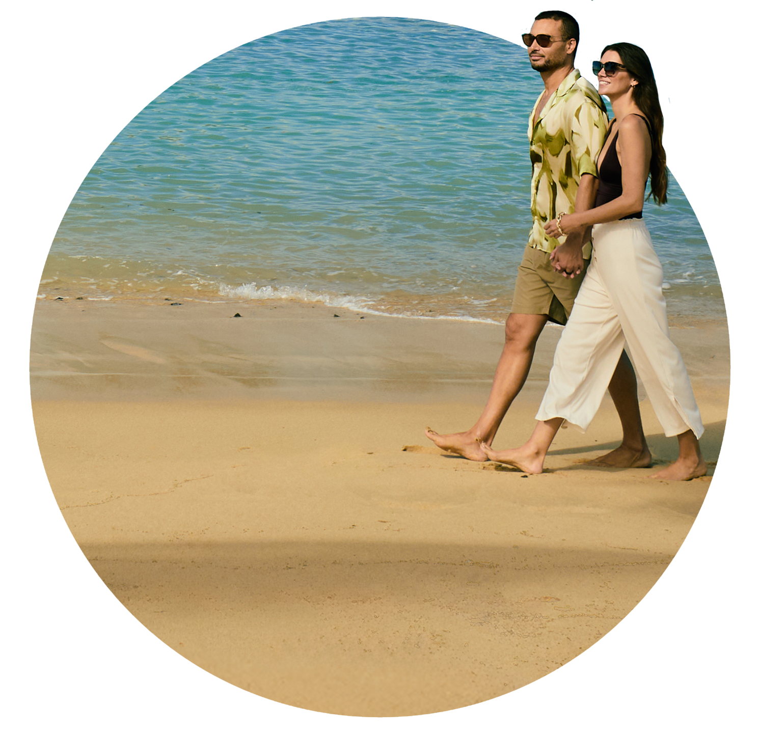 Couple walking down beach