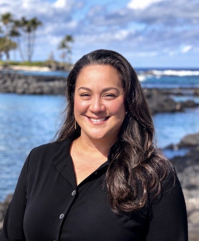 Woman standing in front of the ocean